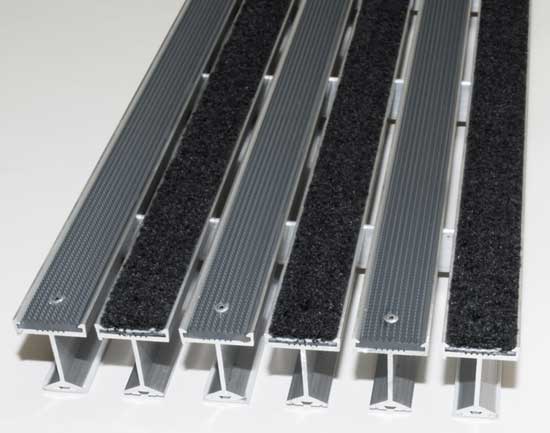 Recessed entry mat and floor grate system with aluminum rails and textile inserts for high-traffic commercial entrances