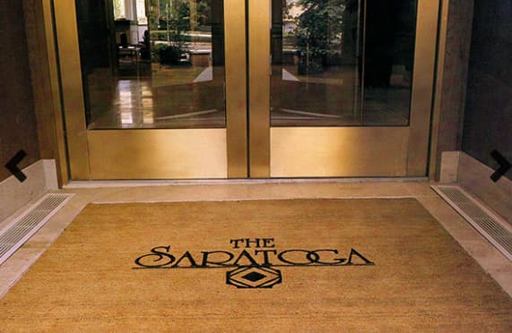 Custom coco mat at building entryway.