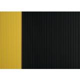 Corrugated vinyl switchboard matting with black surface and yellow safety border