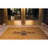 Custom coco coir logo mat set into a recessed entrance well