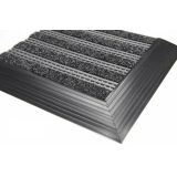 Design Links modular open-weave scrape-and-dry commercial walk-off matting system at an entrance