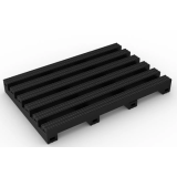 Black open-grid PVC anti-fatigue drainage mat on a wet workplace floor

