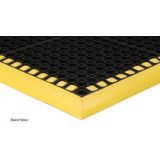Safety Tru-Tread rubber mat with open-hole traction surface and high-visibility yellow beveled edges

