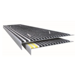Aluminum non-slip stair tread with abrasive grit surface and 1-1/8 inch nose fitted over an existing step