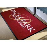 Waterhog Inlay logo mat with a custom company logo at a commercial entrance